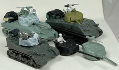 Two Sherman models and an M5 tank model, all unpainted