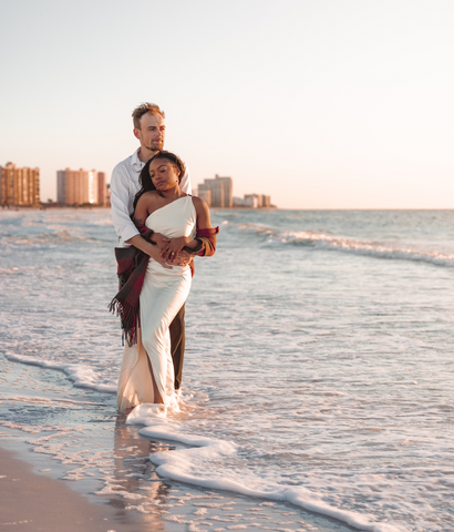 couple posing at the beach for an engagement shoot