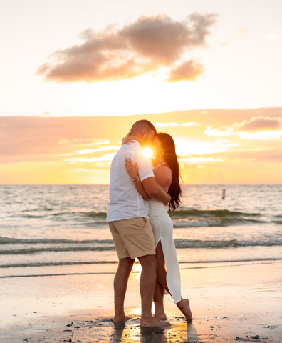 beautiful couple on the beach at sunset
