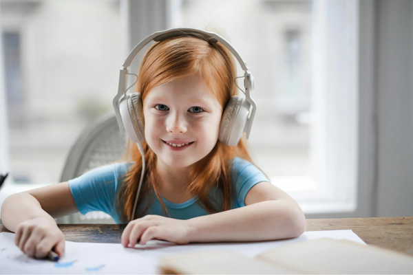 A Happy Kid Using Kids Headphones