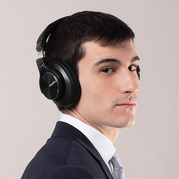 A Guy using ANC Headphones