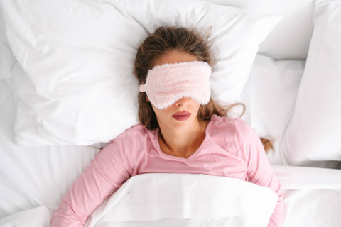 Photo from Google:  Lady in bed asleep comfortably using light block mask