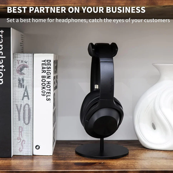 Image of Headphones on Headphone stand placed on the table