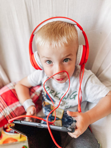 A Child is using Headphones for kids to play games