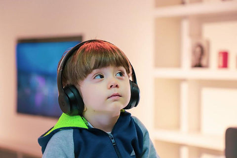 a boy wearing black headphones
