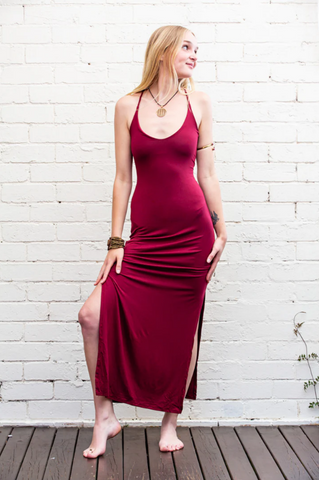 Model wearing a long dress in wine colour