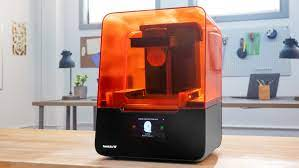 An orange 3D printer