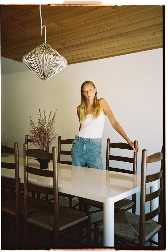Mikaela Simila at her Airbnb in Yucca Valley featuring the Radius Dining Table by RAD Furniture