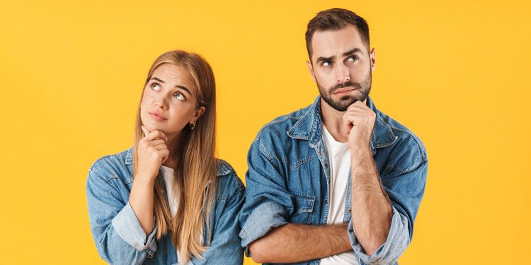 a man and woman with curious expressions 