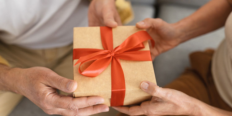 a thoughtful gift wrapped with red ribbon