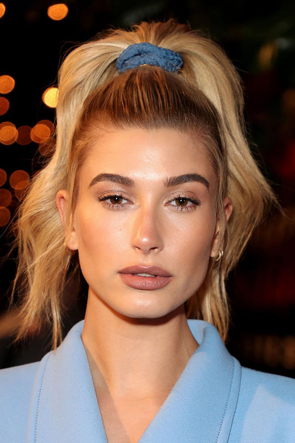 Hailey Bieber wearing a voluminous high pony tail - Viva La Blonde’s top NYE hairstyles 