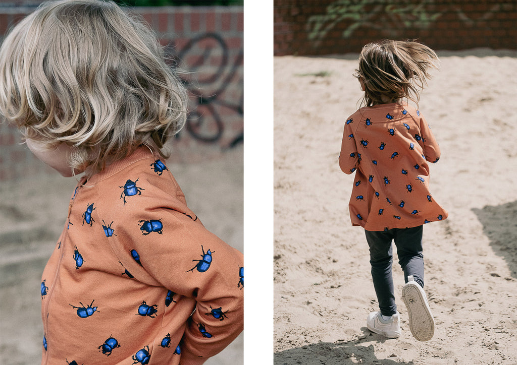 Brown clothes with blue beetles on from the beetles collection, the cardigan and tunic dress