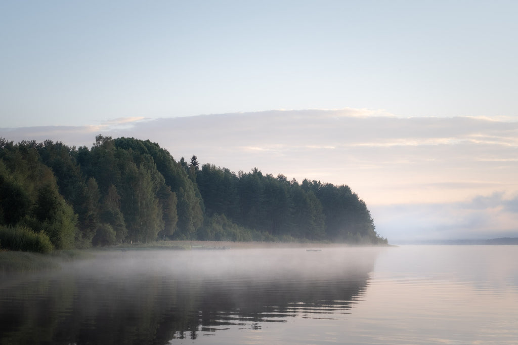 lake fog over a lake in Sweden during sunrise