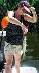 Mom with one of a dozen baby snook.