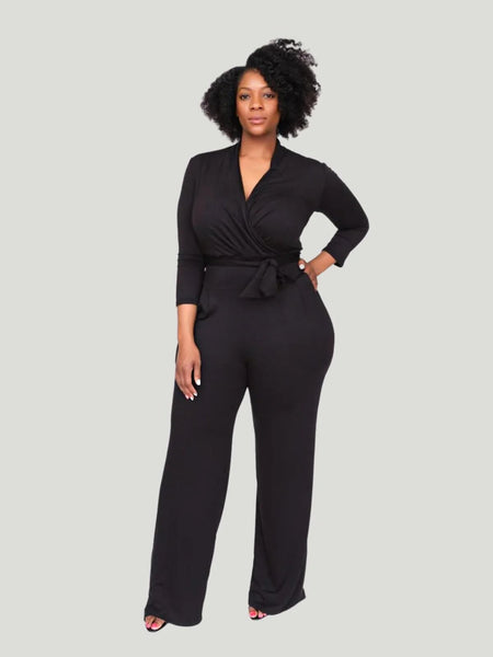 Model is wearing black Taylor Jay London Plus Size Jumpsuit women's plus size outfits new years eve dresses and jumpsuits