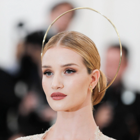 Rosie Huntington-Whiteley wearing a gold halo and earrings by Ana Khouri