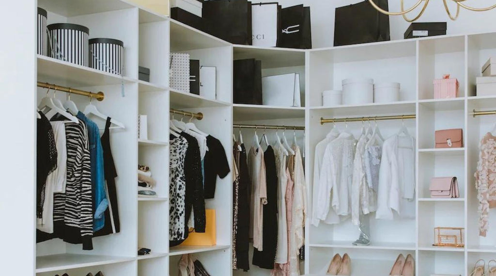 Organized closet with clothes hanging