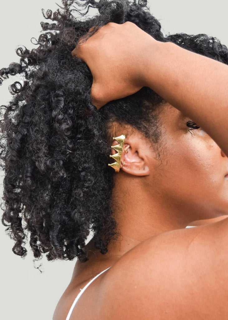 Model wearing Nina Berenato ear cuff in gold