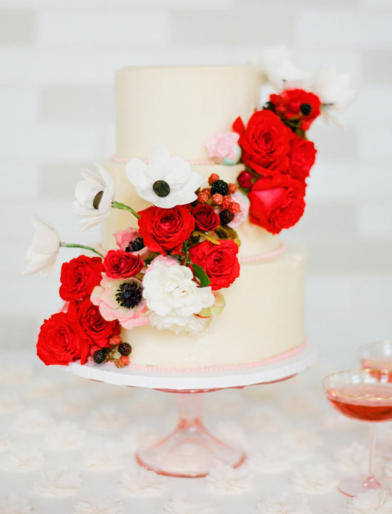 Wedding cake with red cascading roses