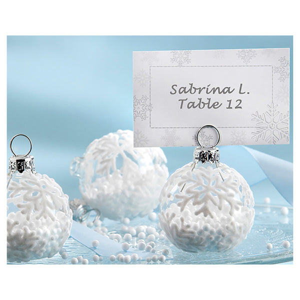 Glass ornament place card holder with snowflakes
