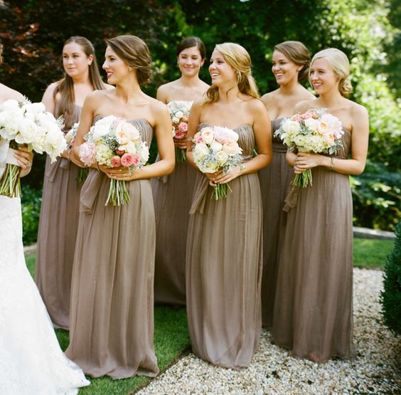 Bridesmaids in warm taupe gowns