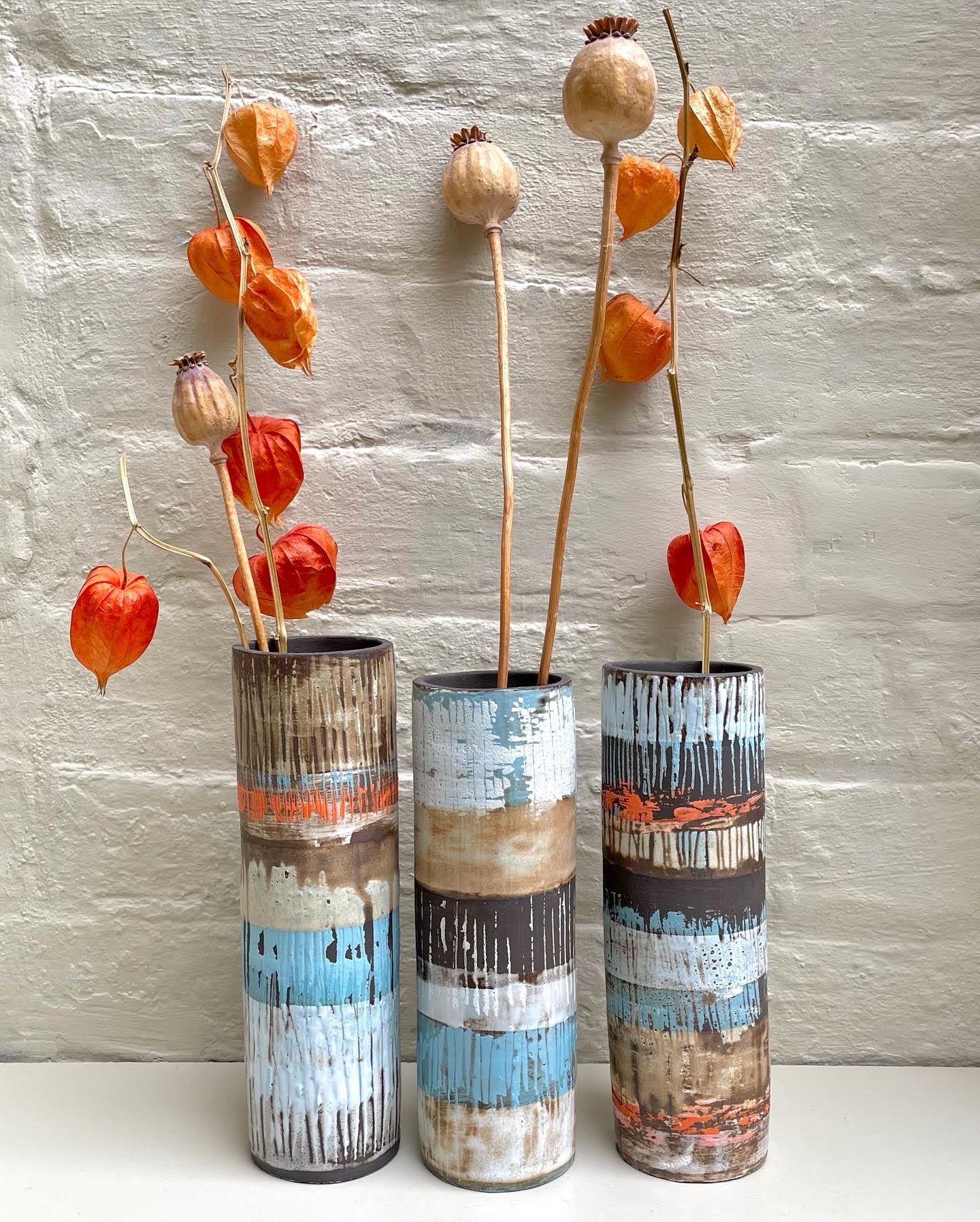 Cylinder vases by Caroline Nuttall-Smith