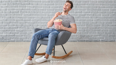 When you're having a movie night with your partner, go for comfy clothes that still look cool. Wear jeans or chinos that fit well and a shirt with a fun design or a nice sweater.