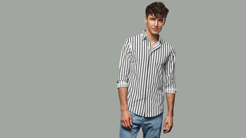 Vertical stripes are another great way to create an illusion of height. Choose a light color shirt with vertical stripes in a darker color. This will draw the eye up, making the man appear taller.