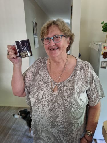 Customer holding her custom pet mug