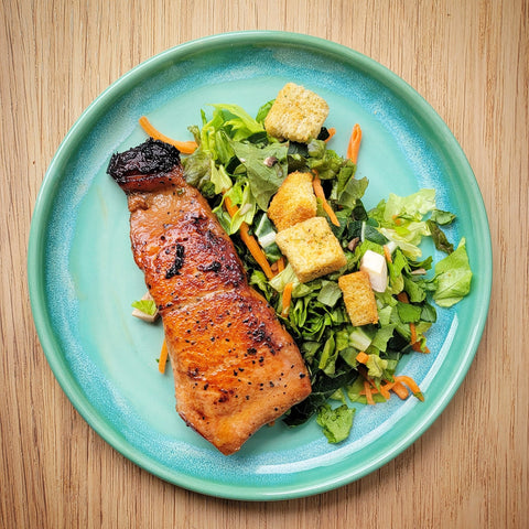 Salmon with Bourbon Brown Sugar Glaze plated with vegetables on a Ocean Jade Lunch Plate