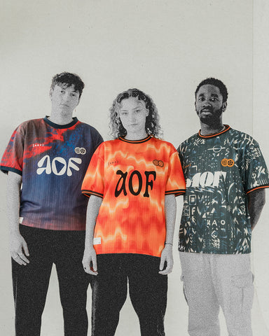 3 people wearing art of football fifa22 football shirts