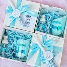Christening gifts for boys wrapped in blue.