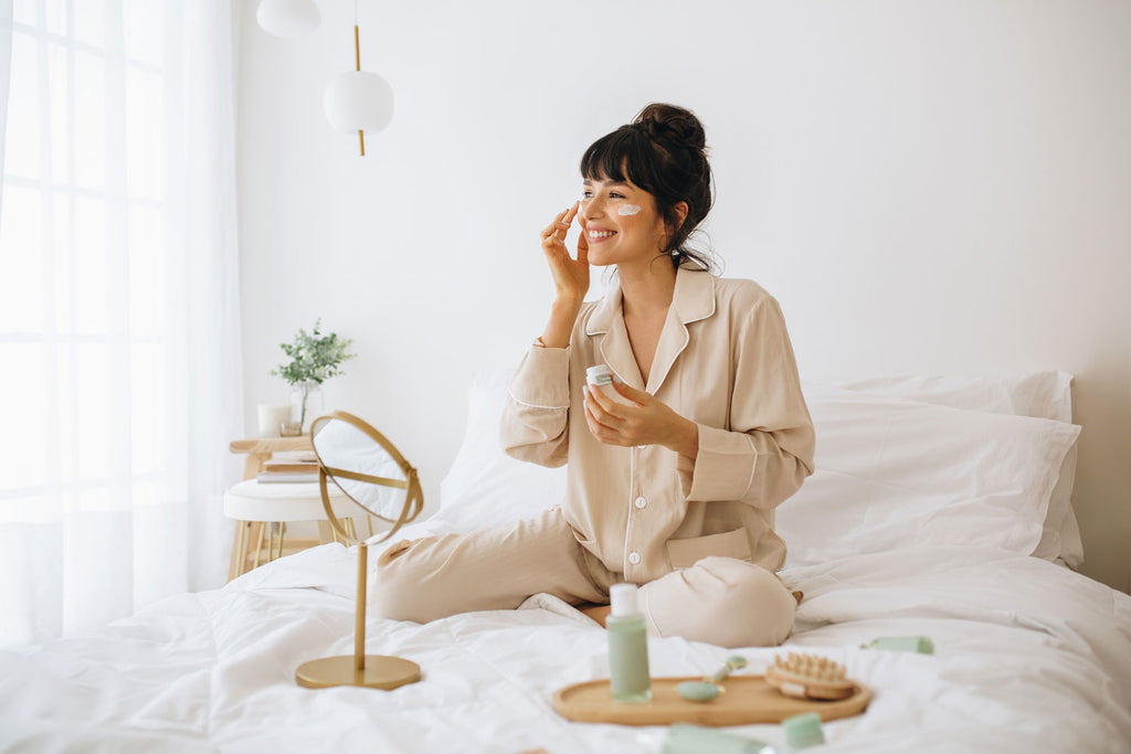 Woman applying skincare products