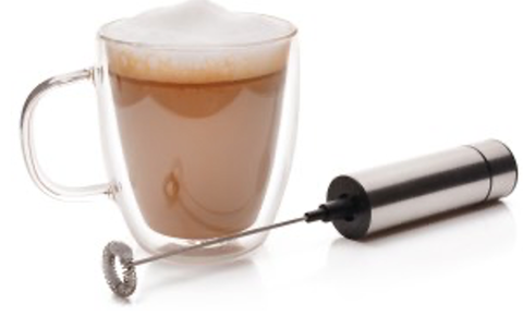 premium milk frother and mug with tea latte topped with frothed milk