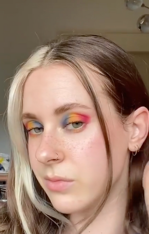 Carnival Makeup: Girl wearing rainbow eyeshadow from the Human Beauty Makeup Therapy Pallete.