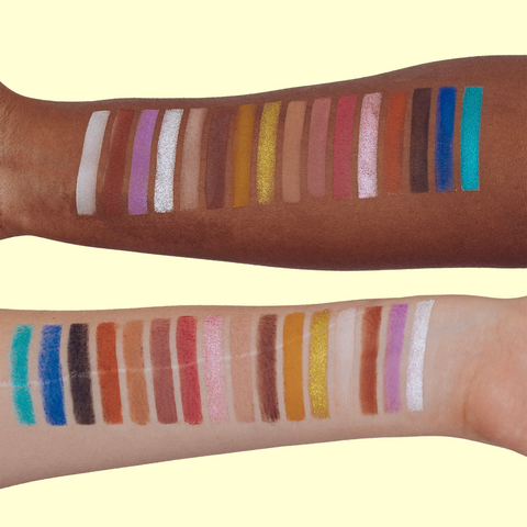 Two arms, one black and one white, each with swatches of the Makeup Therapy palette
