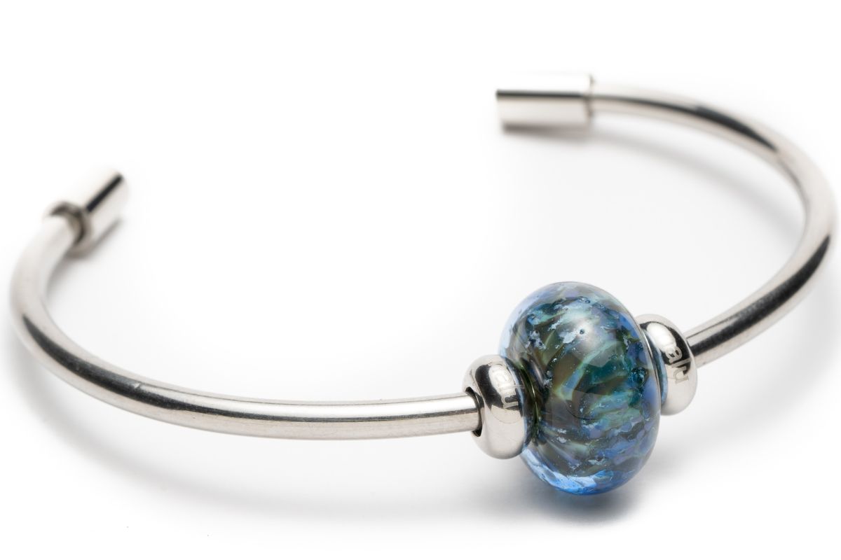 Stainless steel bangle with Polly Joke, Cornwall bead with stopper beads by Nalu Beads