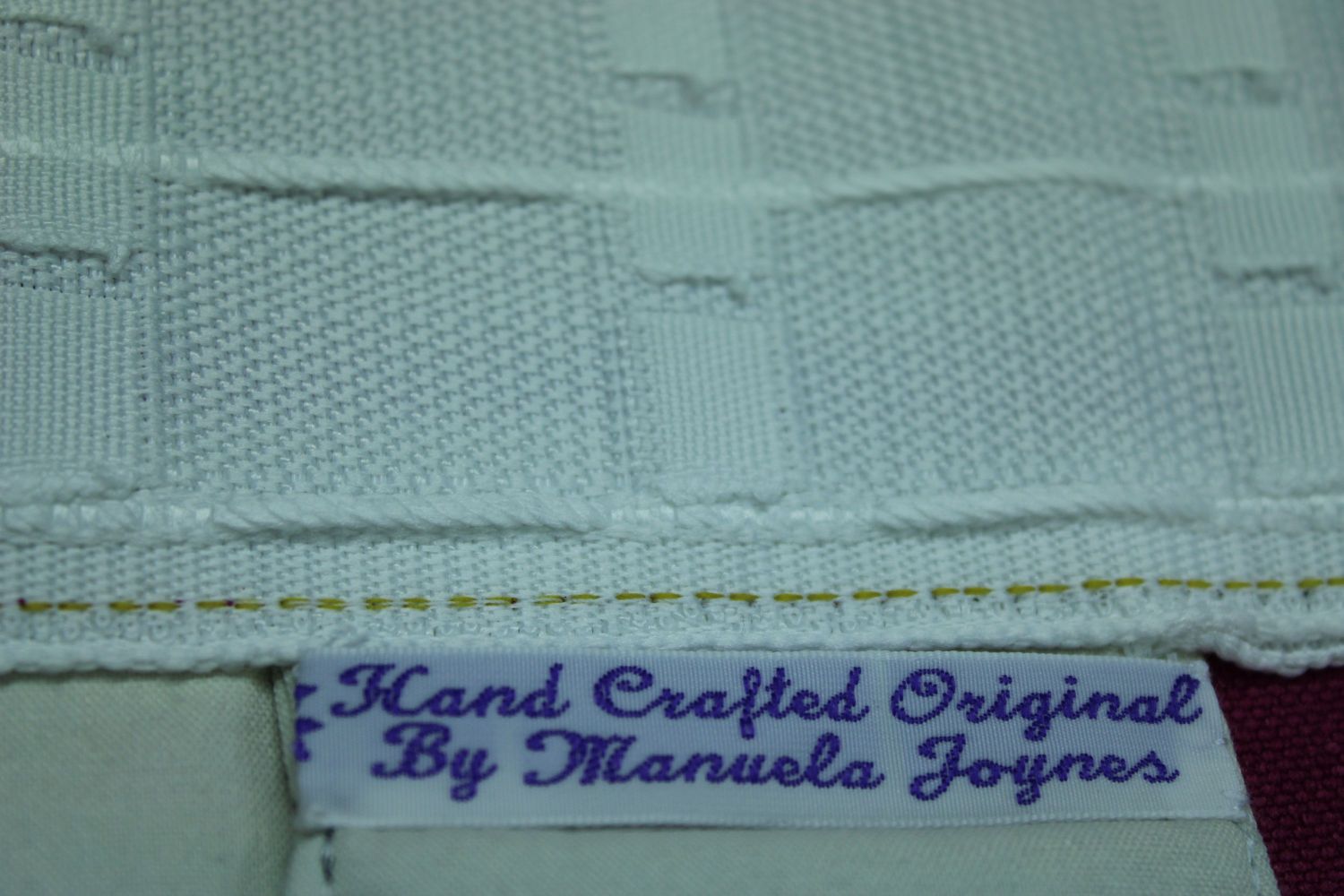 image of finish of top of curtain with label