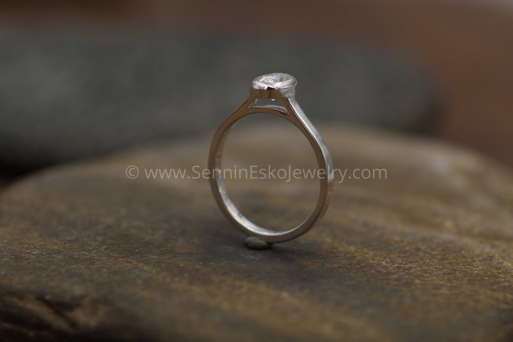 Colorless Moissanite 4x6mm Oval Peekaboo Bezel Solitaire Ring - Foreve –  Sennin Esko Jewelry