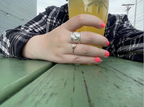 Ambassador Cammy wearing the Fern Frond Double Band Ring from Beth Millner Jewelry while at Drifa Brewing