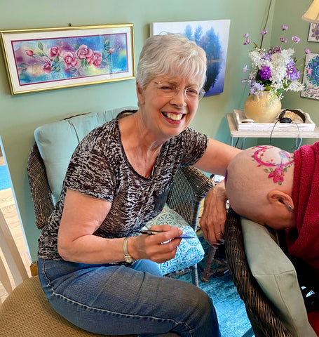 Beth Millner Jewelry Ambassador Kristen's mom painting her head