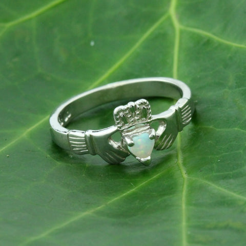 opal claddagh ring, featuring a real natural heart shaped opal gemstone.