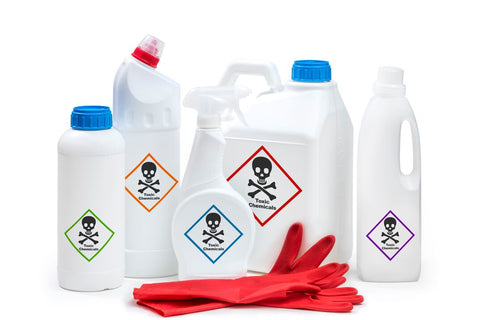 Chemical bottles with danger labels. Household cleaners contain toxic chemicals.