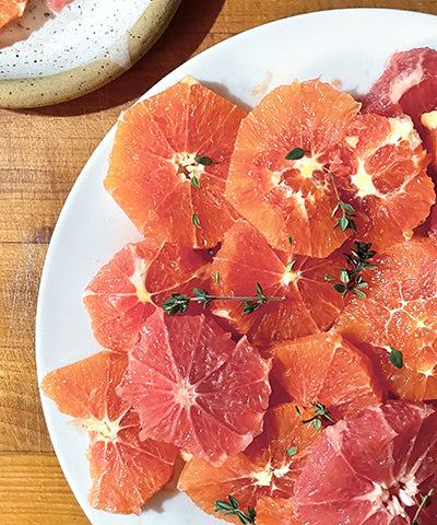 warm citrus rounds topped with thyme