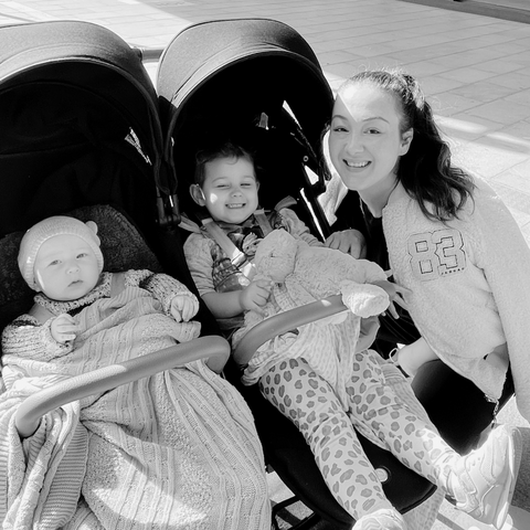 Mum, Olivia (right) shown with her children Olivia and Freddie in a pram.
