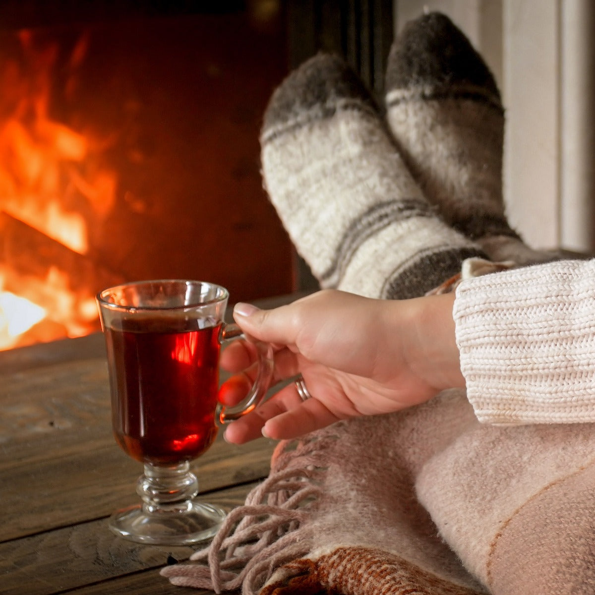 Enjoying a warm drink in front of the fire