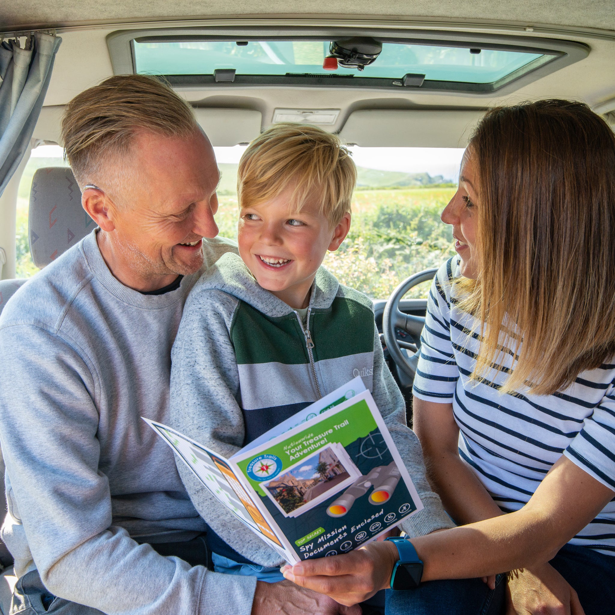Games to Entertain Kids on a Long Car Journey - A Family with a Treasure Trail in a car