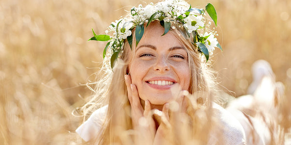 woman in spring field wearing flower crown
