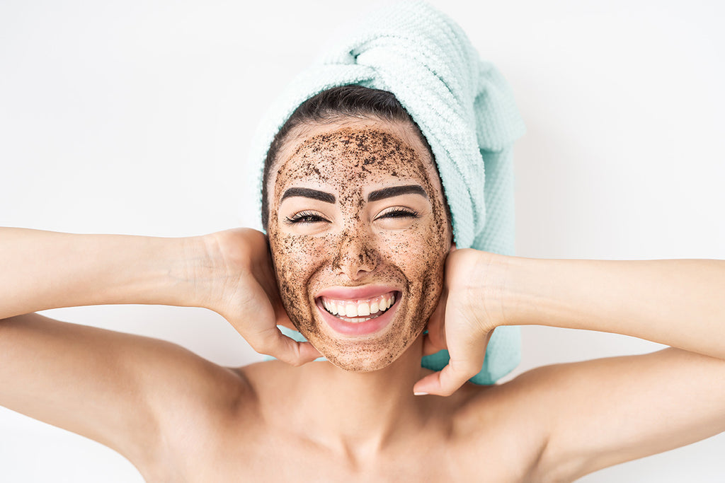 woman wearing coffee scrub on face