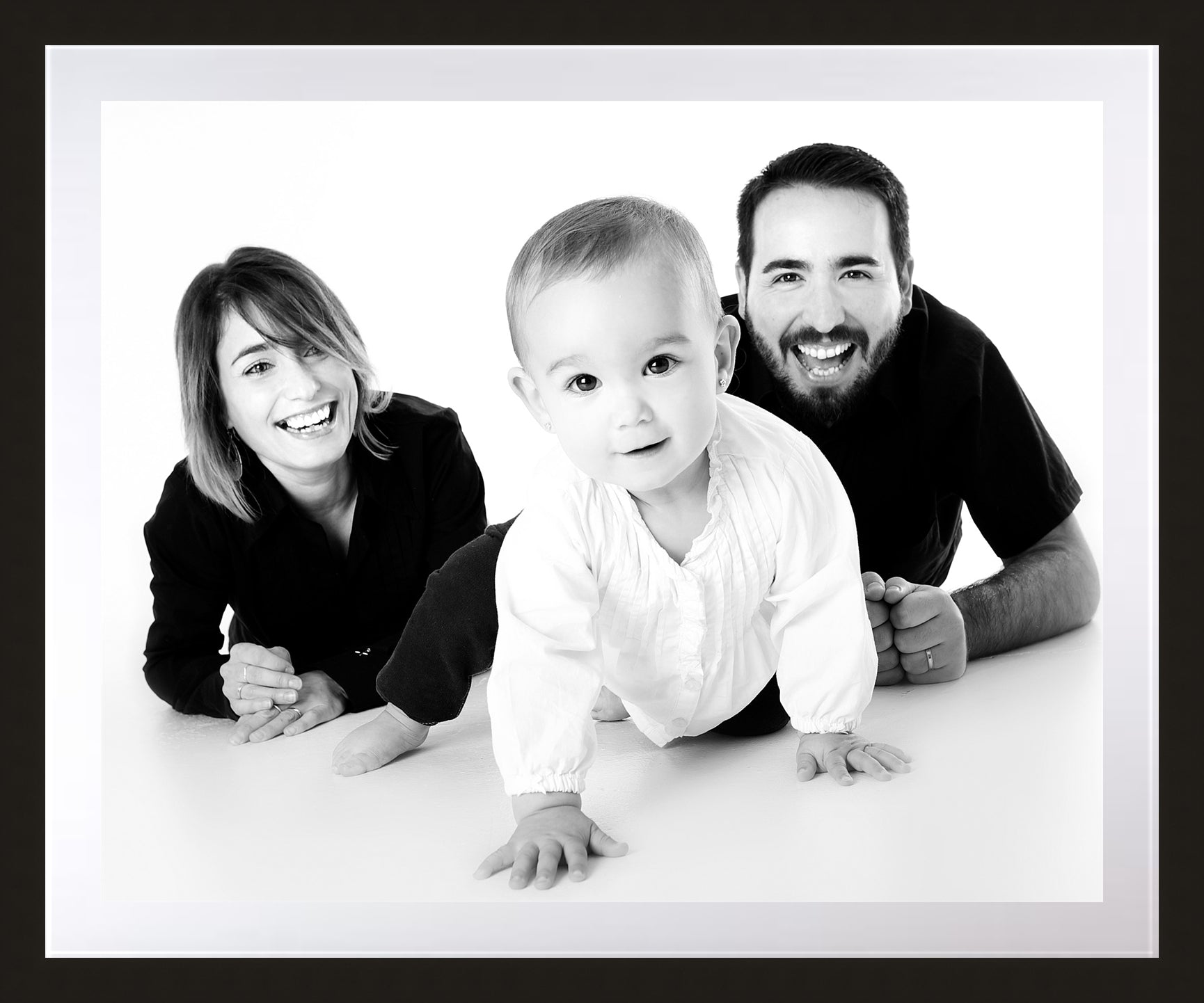 Gallery style picture framing with happy family